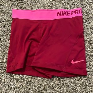 Small Nike Pro red spandex with bright pink band